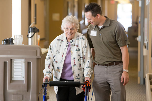 Woman and Staff Member Walking