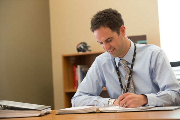 Male employee working at his desk
