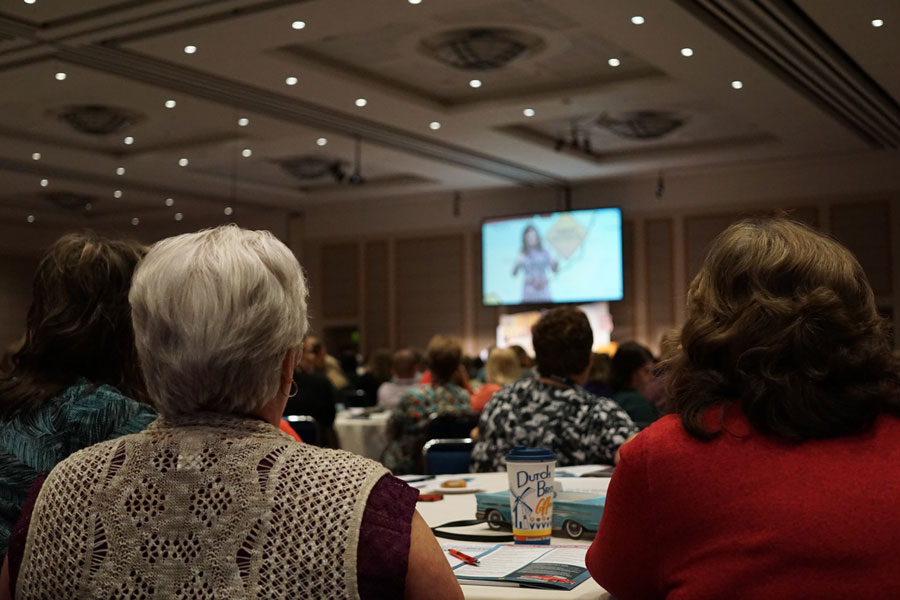 conference attendees listening to speak