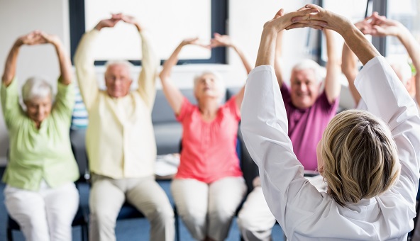 Seniors doing exercises in a retirement home