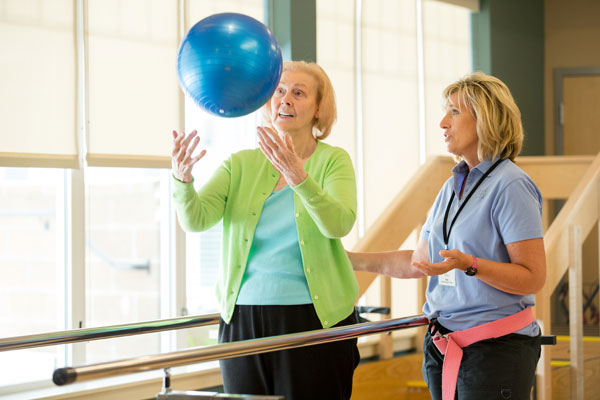 Physical therapist with patient