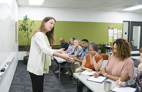 instructor teaching a group of adults