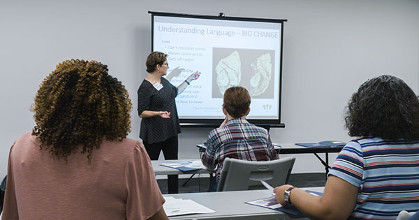 group of students listening to an instructor