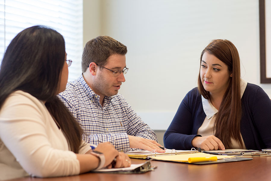 three coworkers meeting