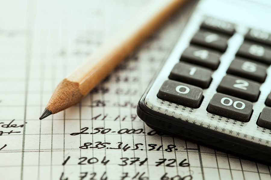 close up of calculator and pencil