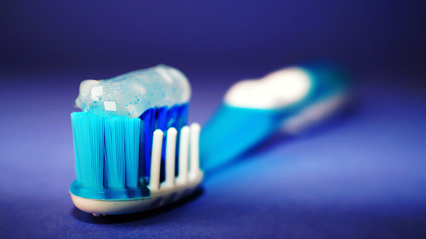 closeup of a colorful, blue toothbrush